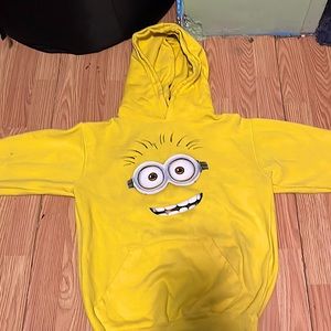 I’m selling a yellow sweater it is a small it’s from universal studios